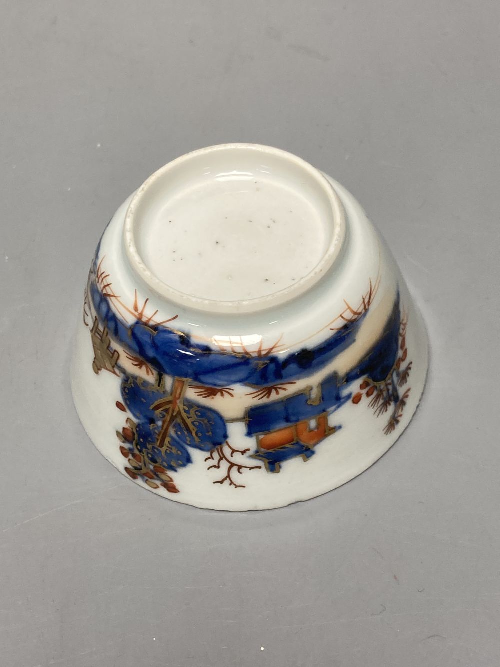 An 18th century Chinese famille rose bowl, 11.5cm diameter, and three smaller Chinese porcelain bowls